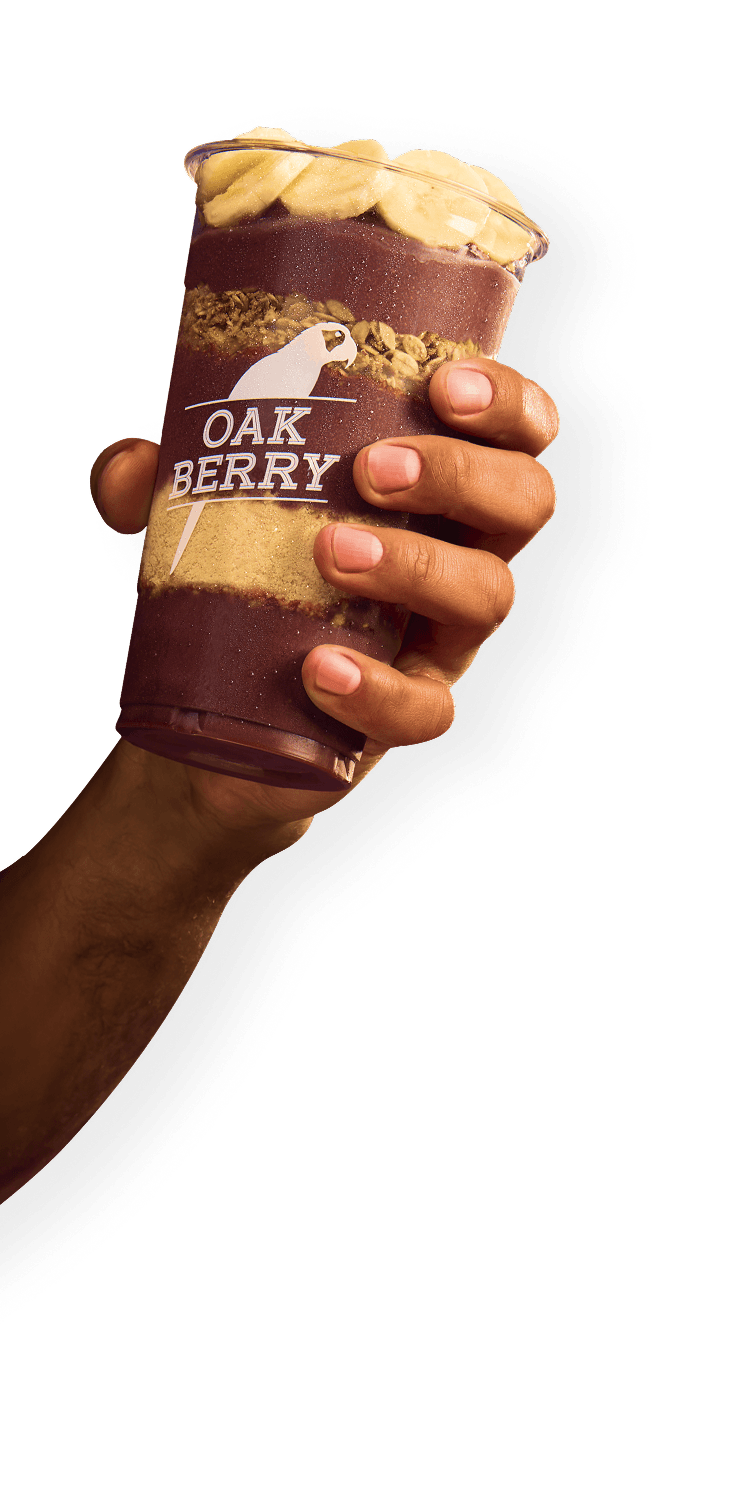 Hand holding Oakberry bowl