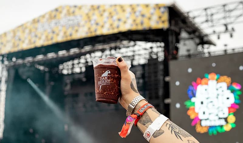 A person holding a cup of Smoothie in Event