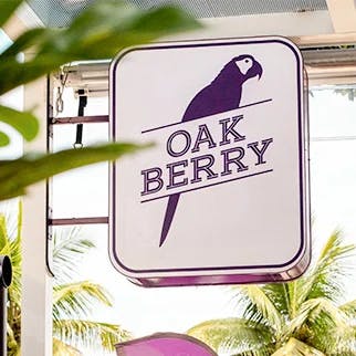 A sign with the oakberry logo